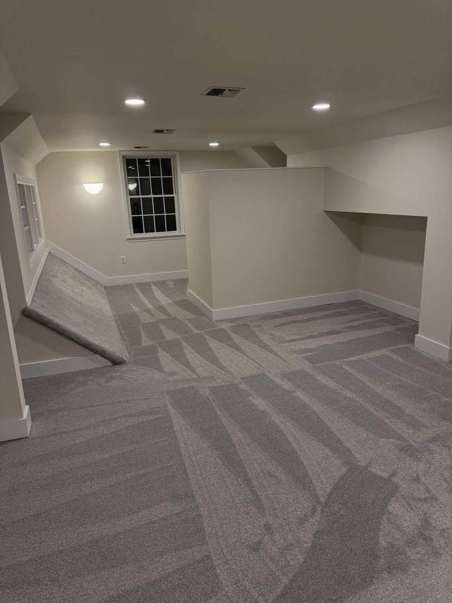 Attic converted into a carpeted bonus room with recessed lighting and fresh paint