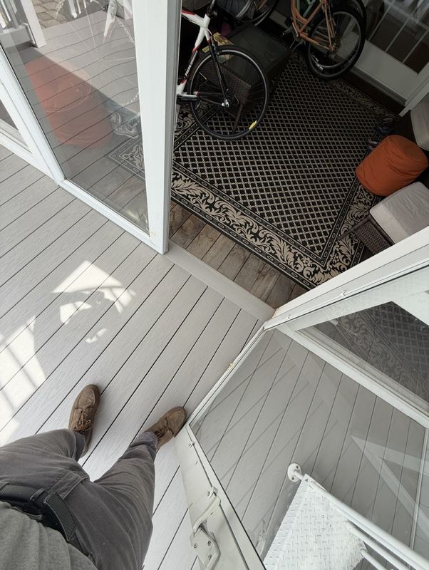 Looking out the doorway onto the new gray composite deck